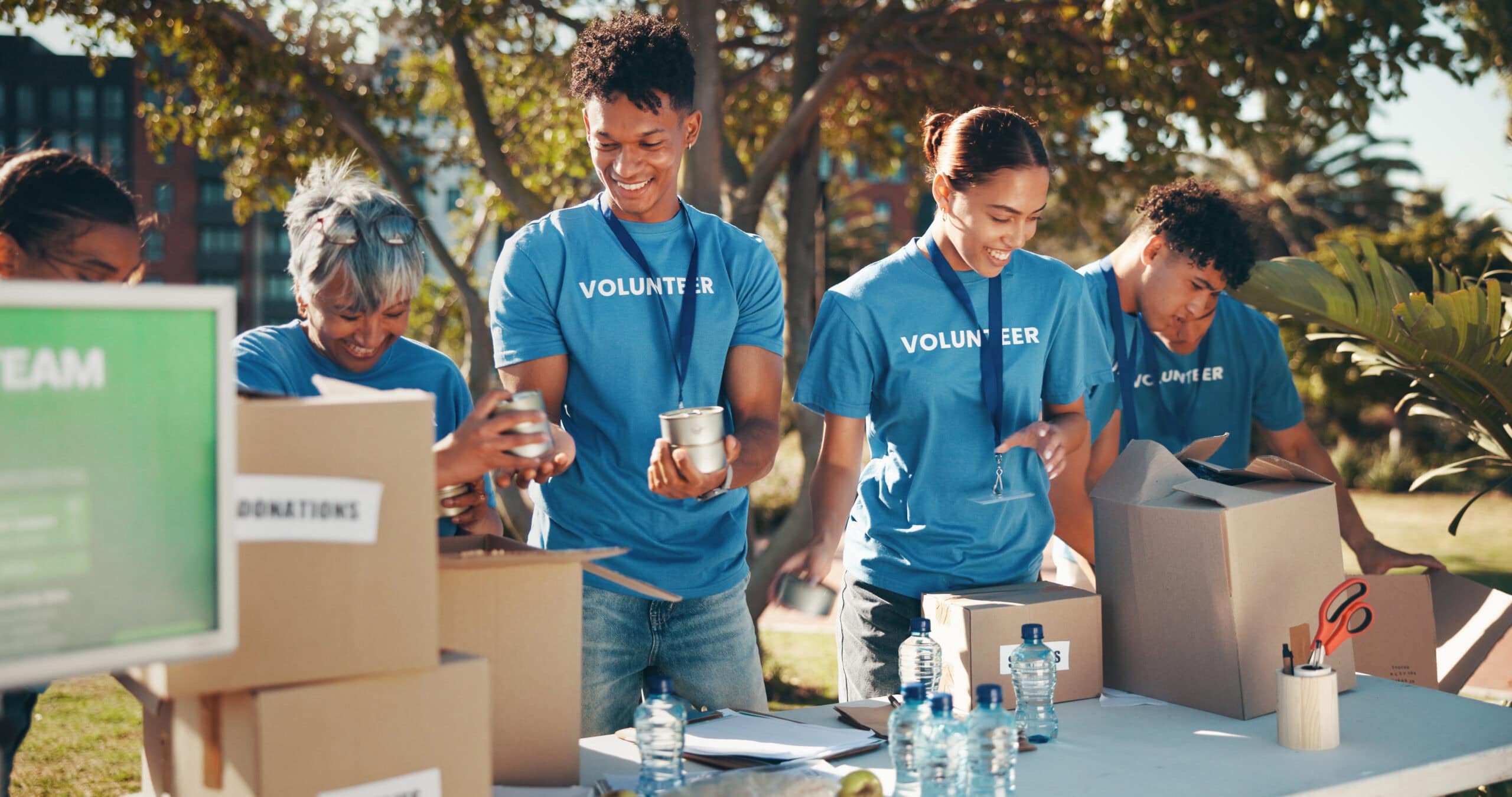 Charity volunteers organizing community outreach from PTP
